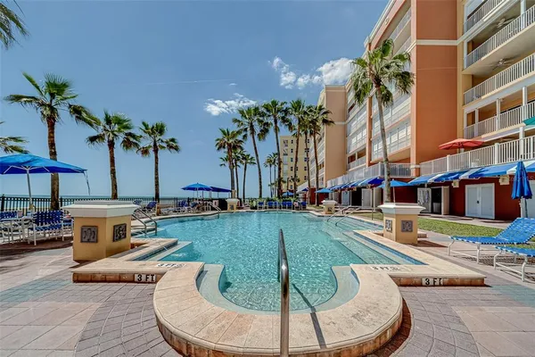 a view of a hallway with paintings on the wall