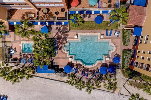 a view of a backyard with a table and chairs