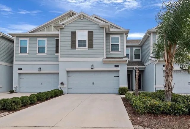 a front view of a house with a garage