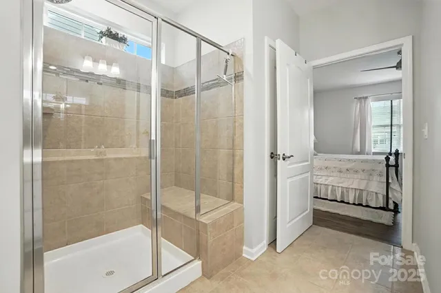 a bathroom with a shower and a sink