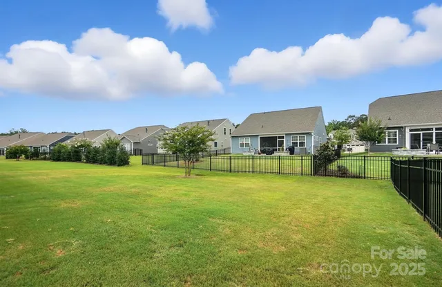 a front view of house with yard and entertaining space