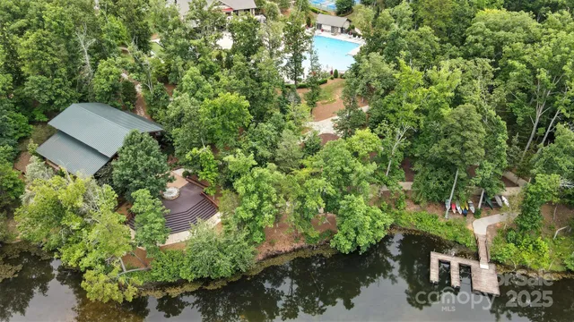 an aerial view of a house with yard