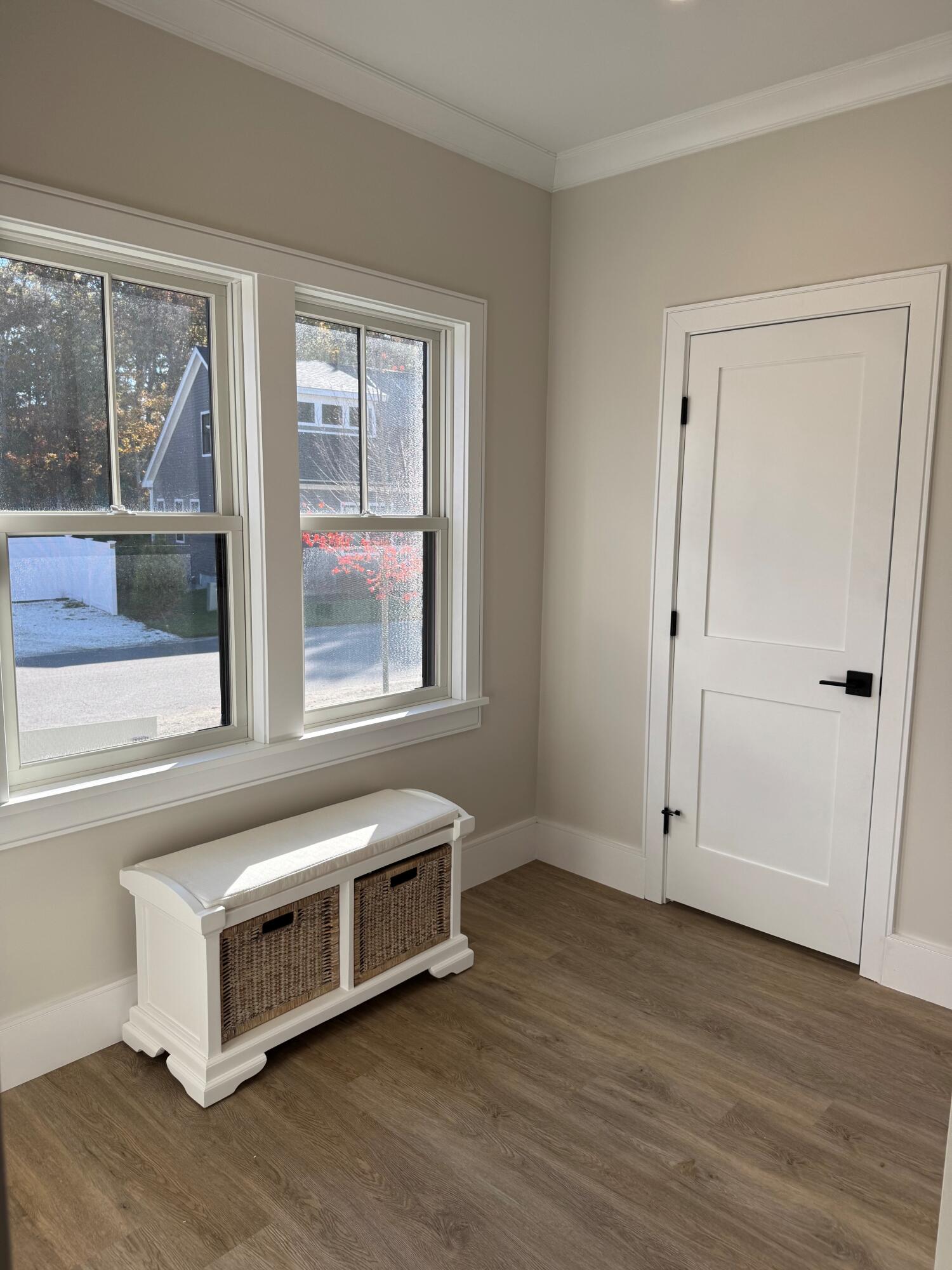 4 Josiah Path Falmouth, MA 02540 - Photo 15 of 26 a room with a bed and a large window with wooden floor