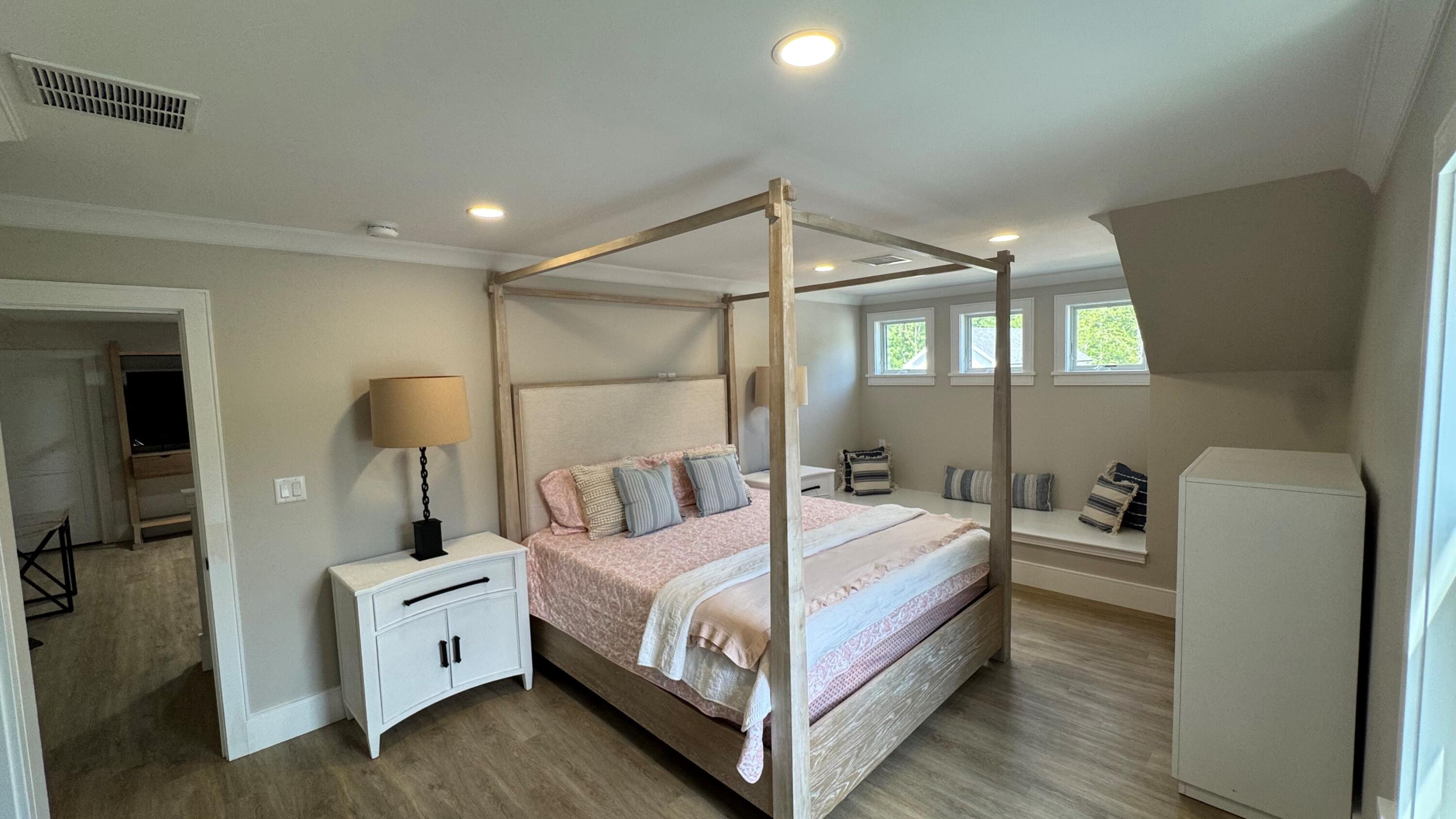 4 Josiah Path Falmouth, MA 02540 - Photo 19 of 26 a bedroom with a bed and a chair