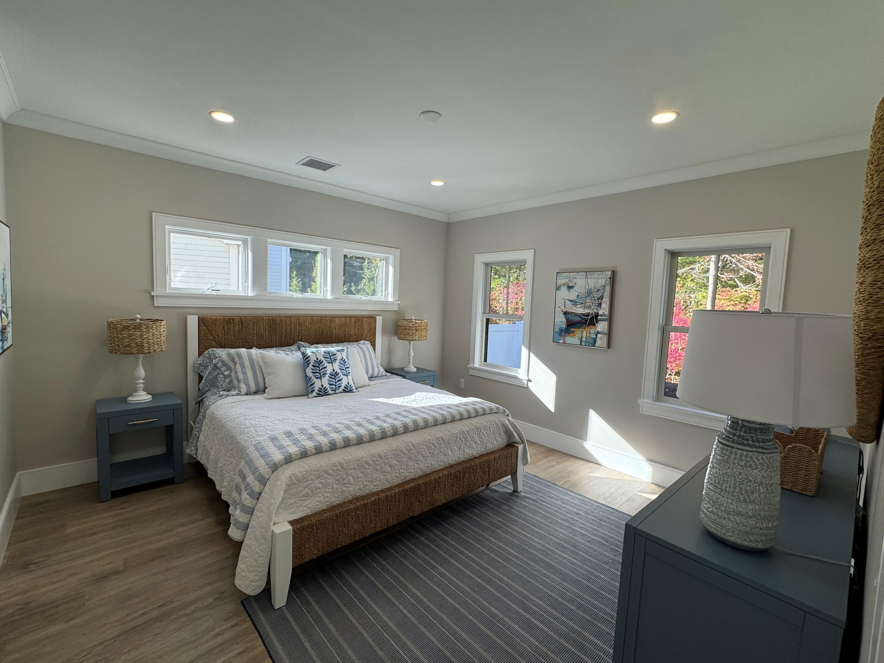 4 Josiah Path Falmouth, MA 02540 - Photo 9 of 26 a bedroom with a bed and wooden floor