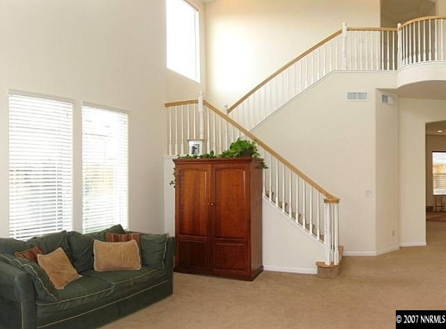 1626 Moquith Court Reno, NV 89521 - Photo 2 of 9 a living room with furniture and stairs