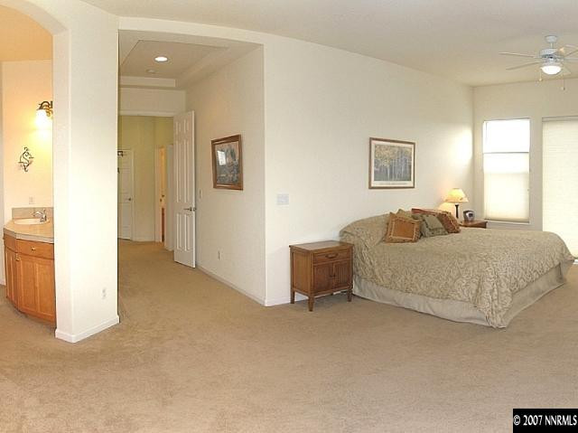 1626 Moquith Court Reno, NV 89521 - Photo 7 of 9 a bedroom with a bed and a painting
