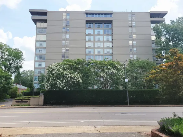 a view of building with garden space
