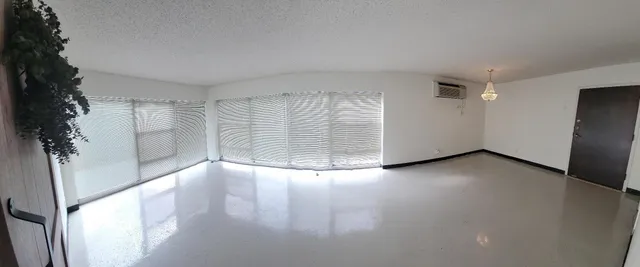 a kitchen with a sink a stove and cabinets