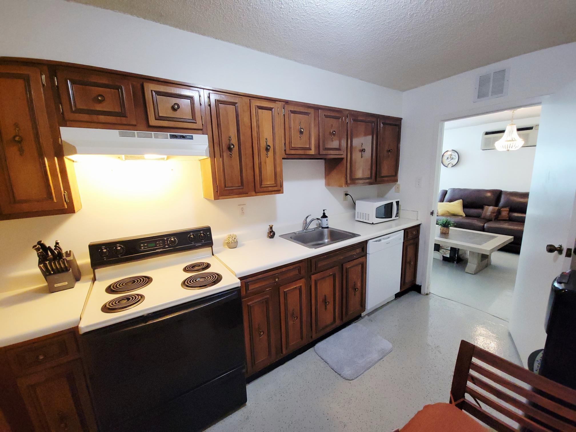 232 South Highland Street, Unit 608 Memphis, TN 38111 - Photo 22 of 40 a kitchen that has a sink and a stove in it