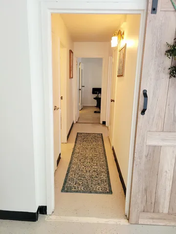 a spacious bathroom with a double vanity sink toilet and shower