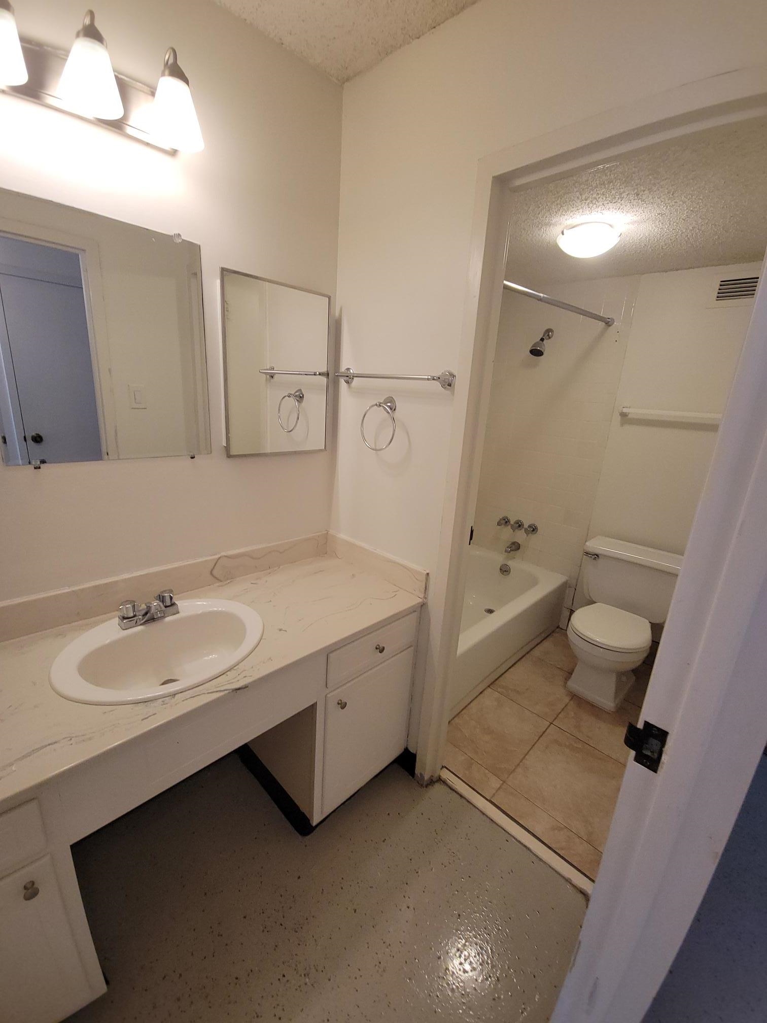 232 South Highland Street, Unit 608 Memphis, TN 38111 - Photo 27 of 40 a spacious bathroom with a double vanity sink toilet and shower