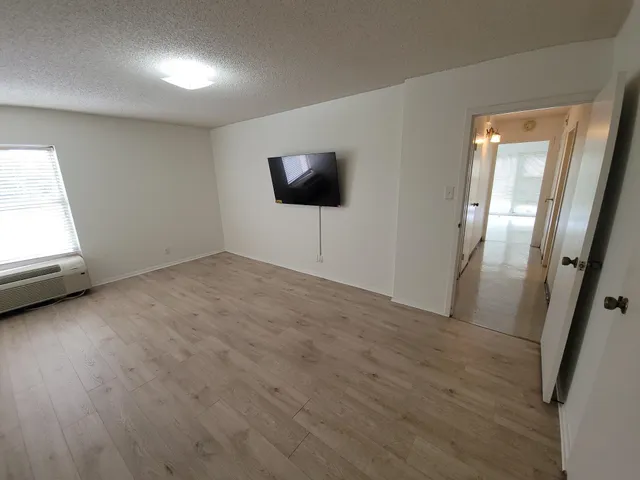a view of a livingroom with wooden floor