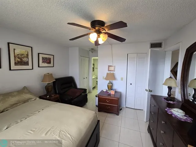 a living room with furniture a window and gym equipment