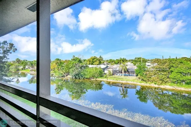 a view of a lake with a building in the background