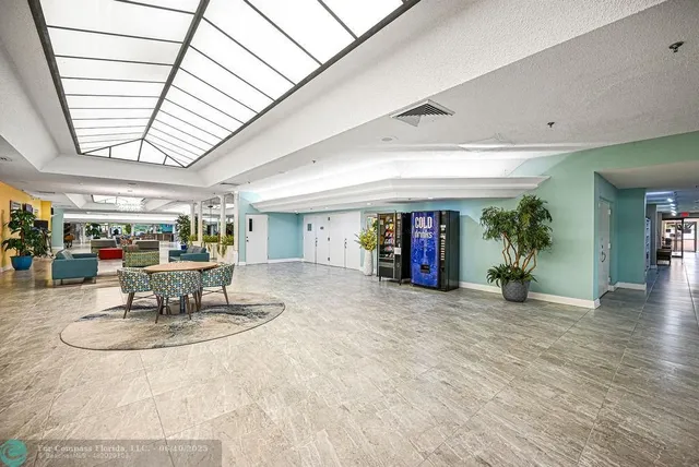 a hallway with a book shelf and a bookshelf