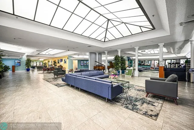 a living room with lots of furniture and a flat screen tv