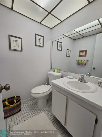 a living room with furniture a lamp and a window