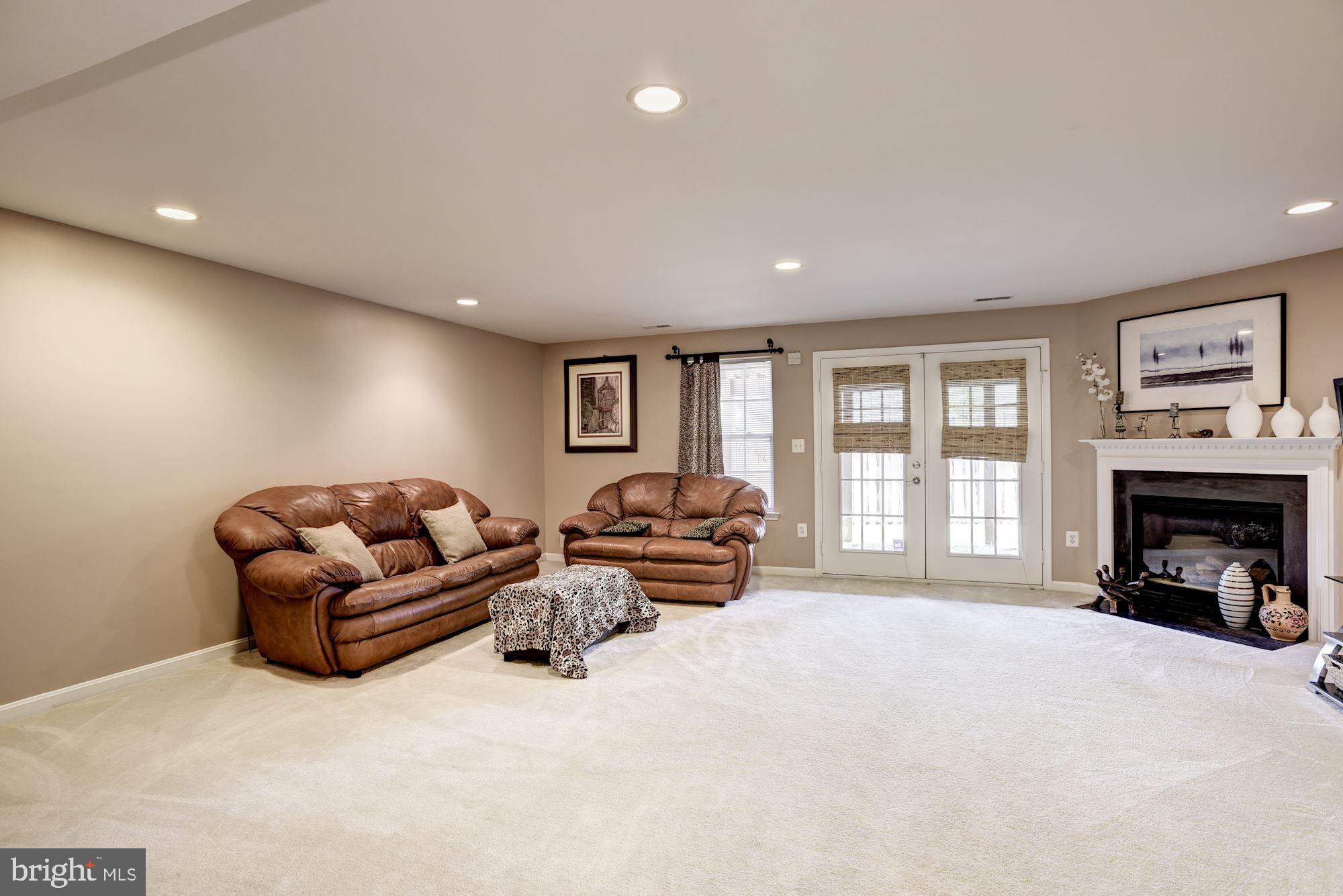 649 Springhouse Square Southeast Leesburg, VA 20175 - Photo 18 of 21 Large Recreation Room with fireplace