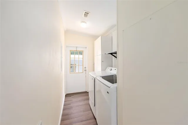 a view of deck with white fence and trees