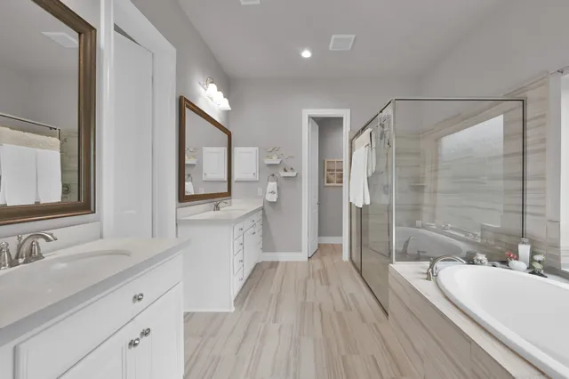 a view of a workspace with furniture and white cabinet
