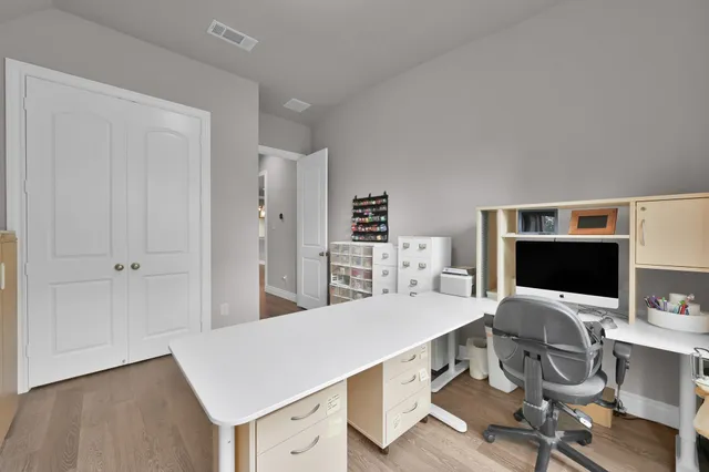 a aerial view of a house with a yard