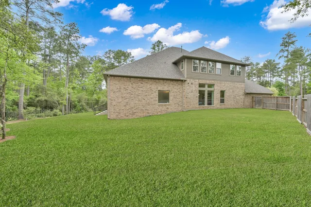 a view of a park with large trees