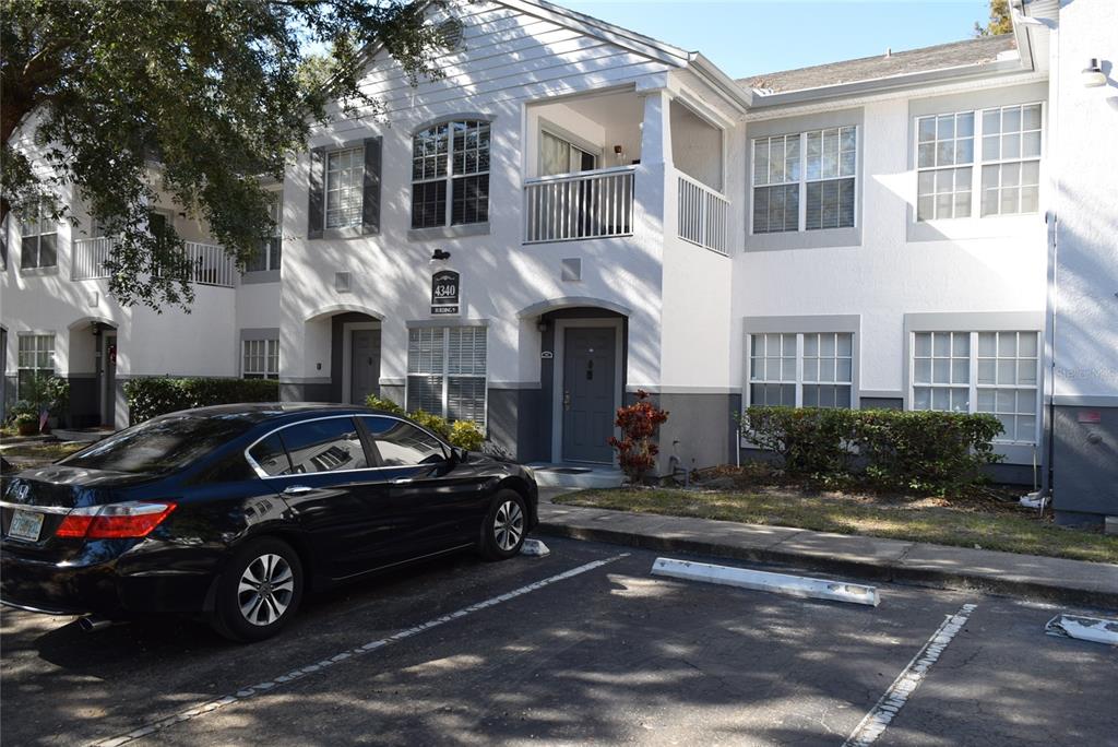 4340 South Kirkman Road, Unit 905 Orlando, FL 32811 - Photo 1 of 1 a car parked in front of a house