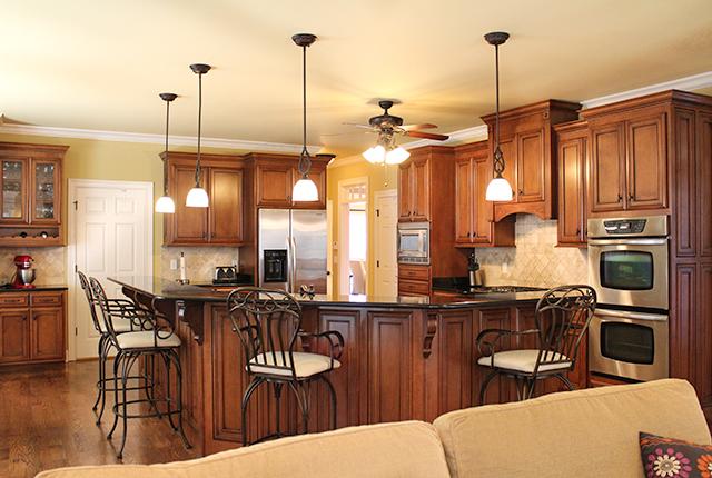 5336 Sherrington Road Murfreesboro, TN 37128 - Photo 9 of 20 Kitchen features a large breakfast bar, 4 pendant lights and built-ins.