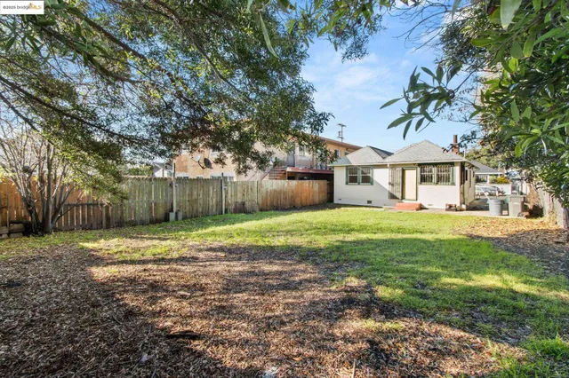 a backyard of a house with lots of green space