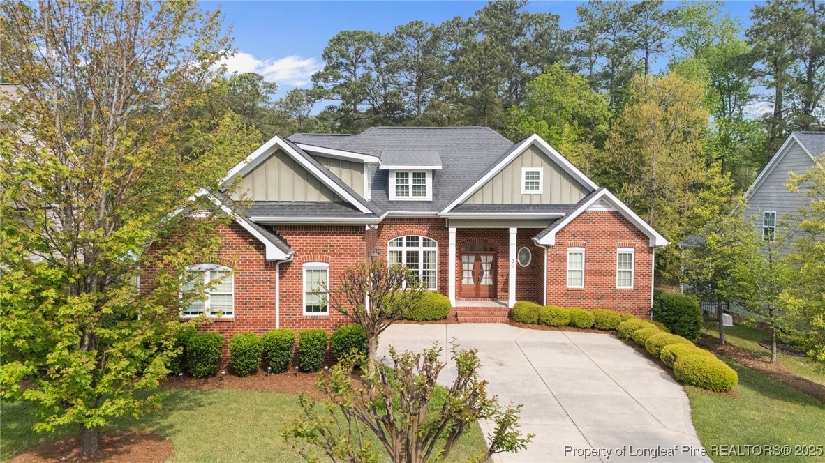 30 Spring Pond Lane Spring Lake, NC 28390 - Photo 1 of 35 a front view of a house with a garden