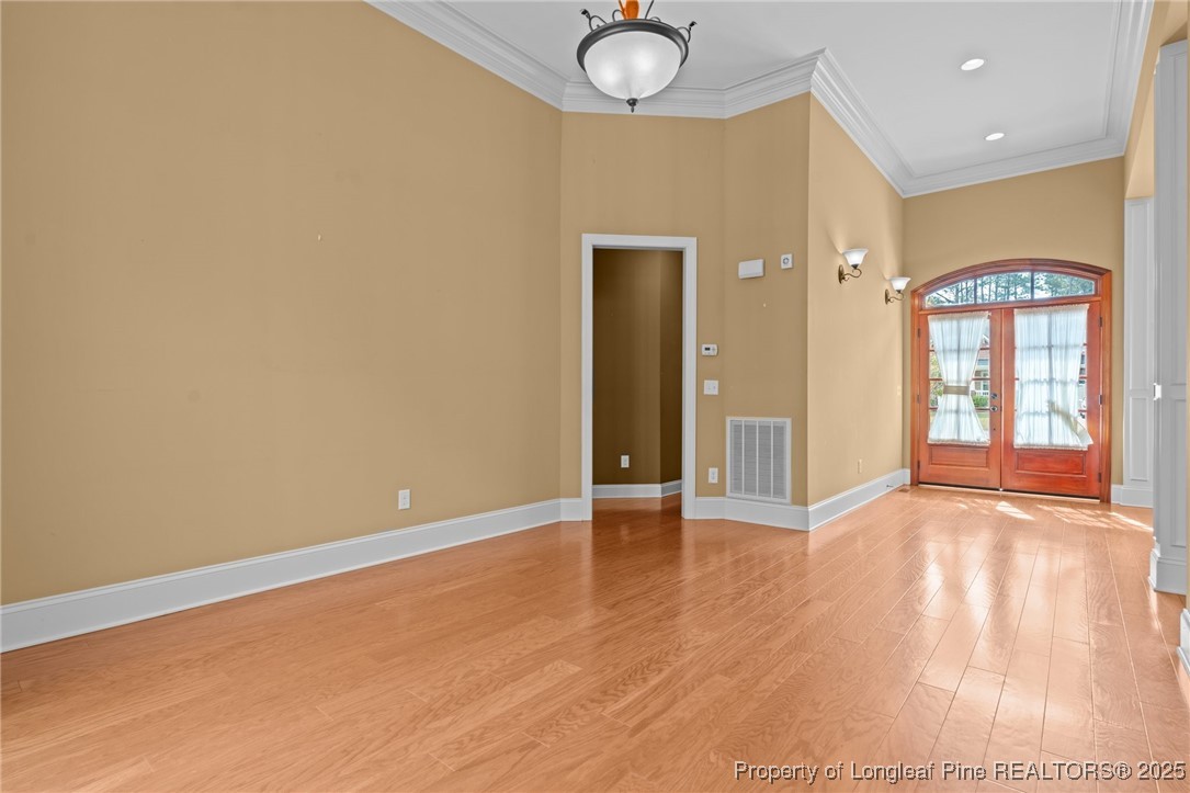 30 Spring Pond Lane Spring Lake, NC 28390 - Photo 14 of 35 an empty room with wooden floor and windows