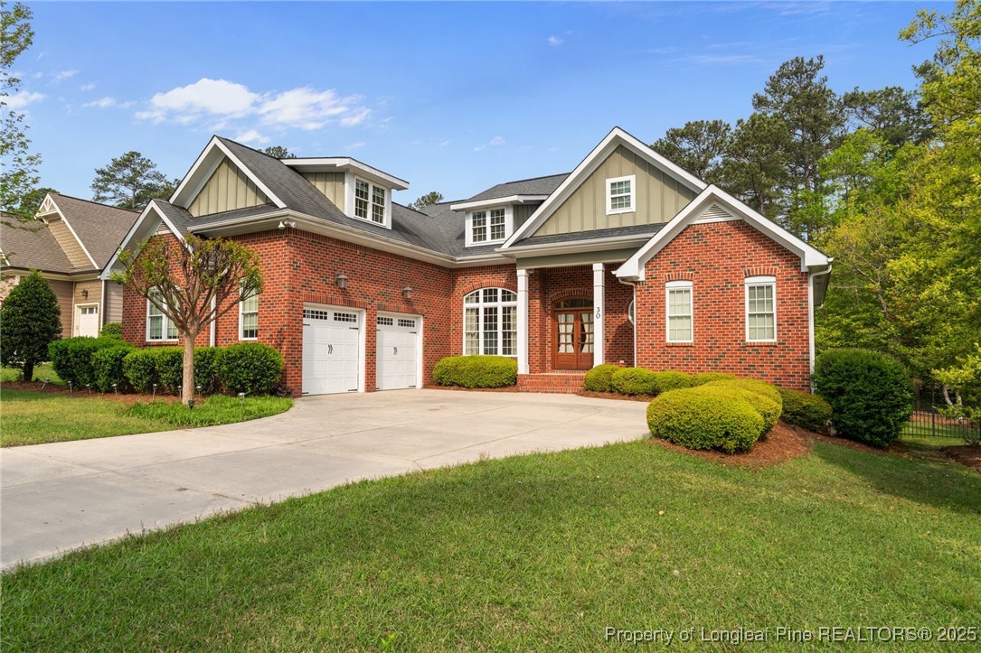 30 Spring Pond Lane Spring Lake, NC 28390 - Photo 2 of 35 a front view of a house with yard and green space