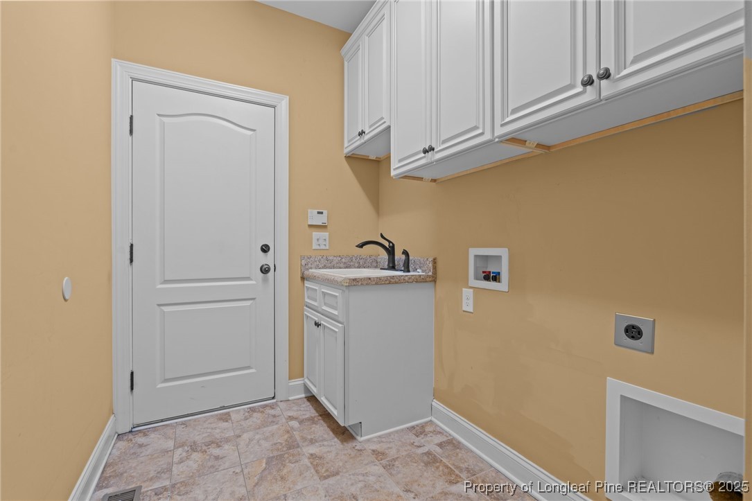 30 Spring Pond Lane Spring Lake, NC 28390 - Photo 24 of 35 a view of storage and utility room with closet