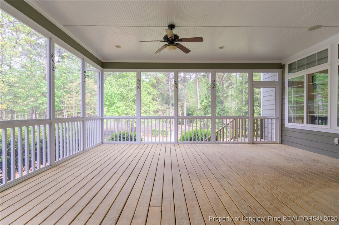 30 Spring Pond Lane Spring Lake, NC 28390 - Photo 7 of 35 a view of a room with wooden floor and a ceiling fan