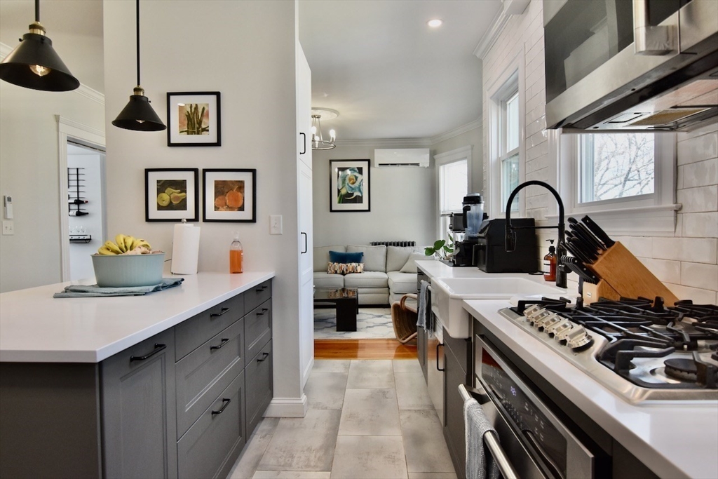 14 Castlerock Street, Unit 14 Boston, MA 02125 - Photo 1 of 32 a kitchen with a stove and a sink