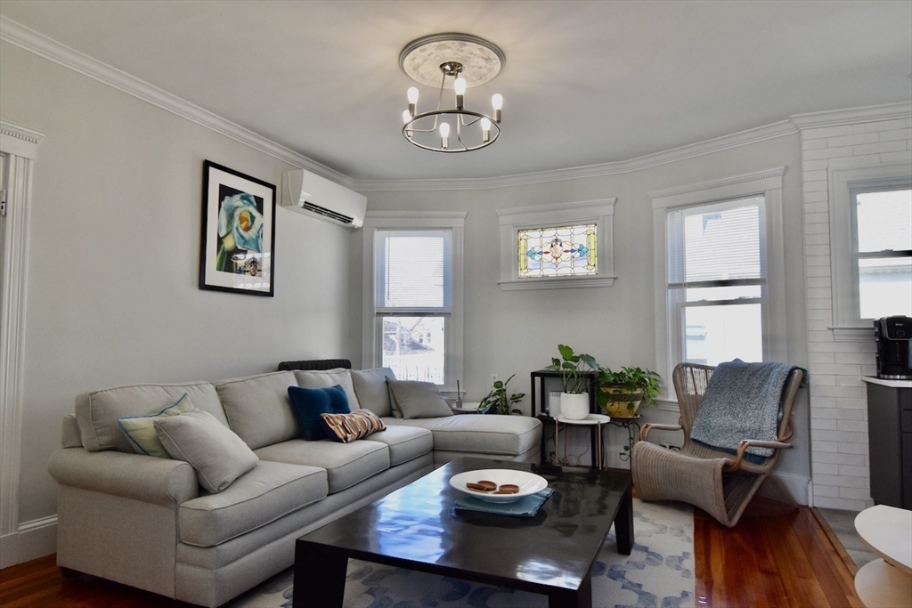 14 Castlerock Street, Unit 14 Boston, MA 02125 - Photo 11 of 32 a living room with furniture and window