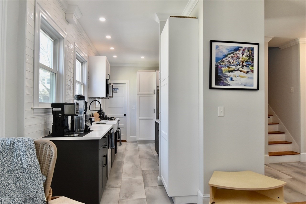 14 Castlerock Street, Unit 14 Boston, MA 02125 - Photo 14 of 32 a kitchen with a refrigerator and a sink