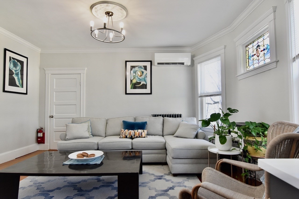 14 Castlerock Street, Unit 14 Boston, MA 02125 - Photo 2 of 32 a living room with furniture and white walls