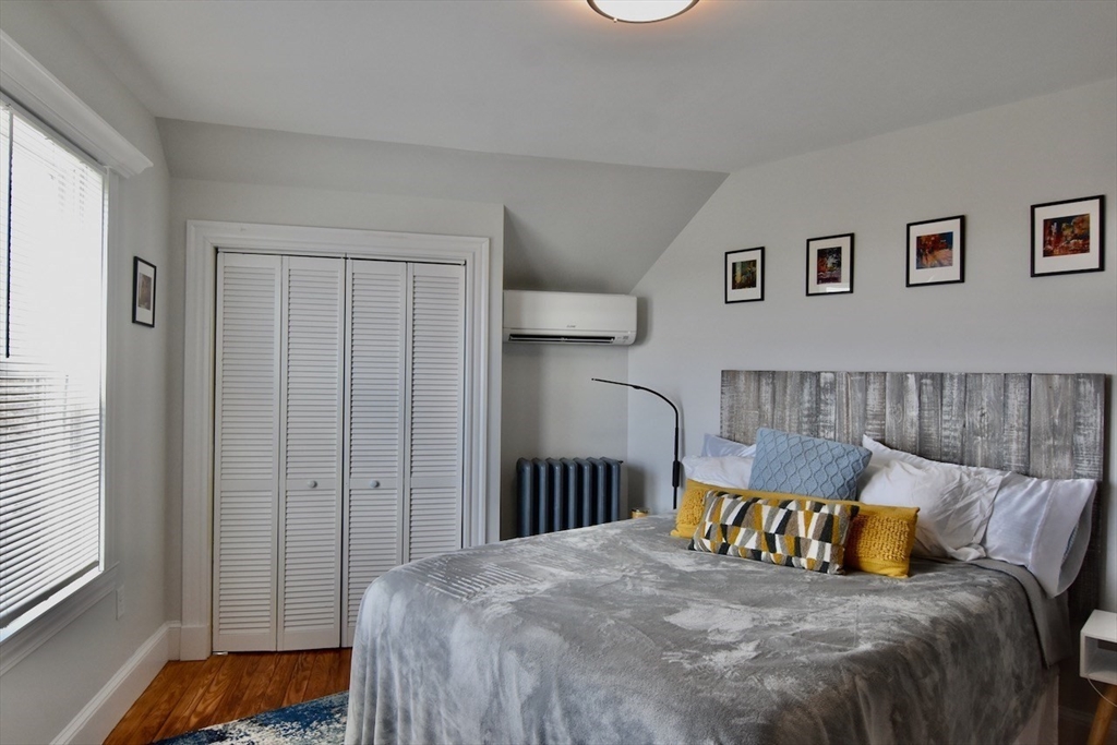 14 Castlerock Street, Unit 14 Boston, MA 02125 - Photo 26 of 32 a bedroom with a bed and a window