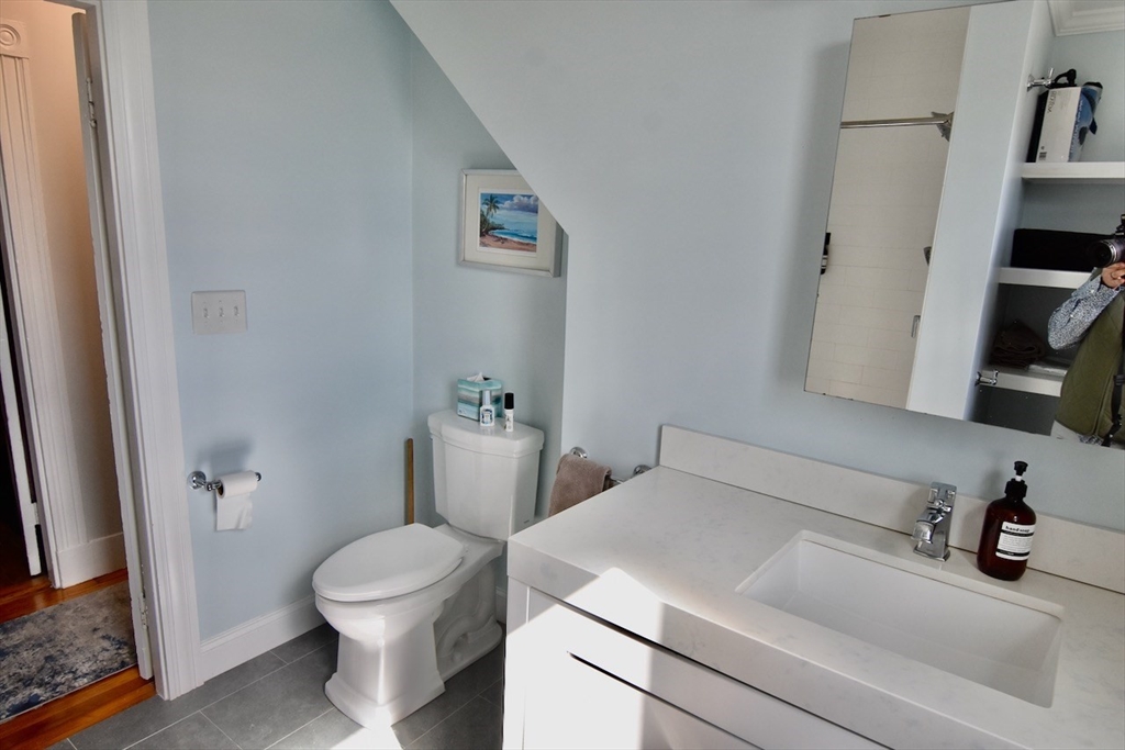 14 Castlerock Street, Unit 14 Boston, MA 02125 - Photo 29 of 32 a bathroom with a sink and toilet