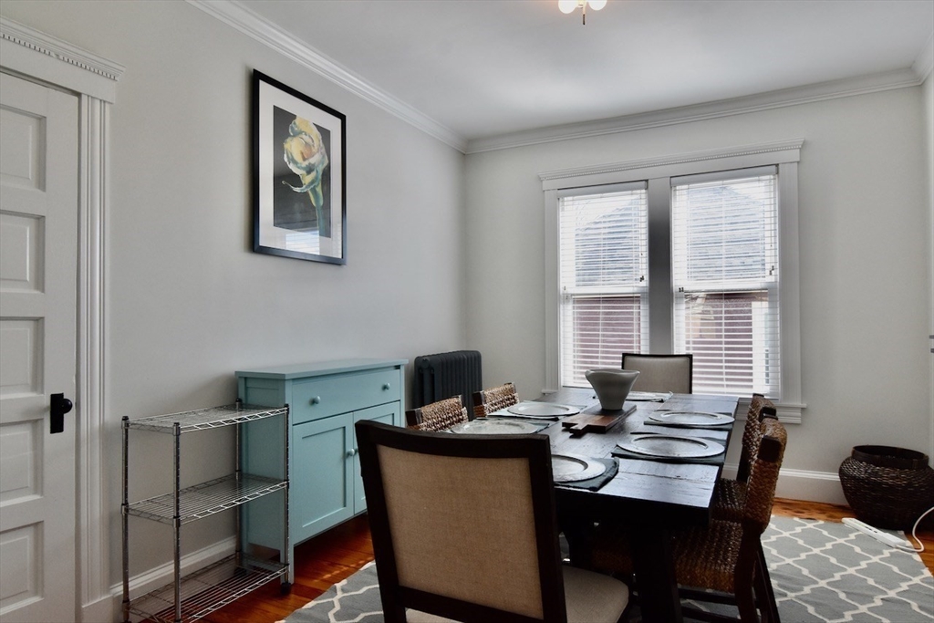 14 Castlerock Street, Unit 14 Boston, MA 02125 - Photo 8 of 32 a view of a dining room with a table and chairs