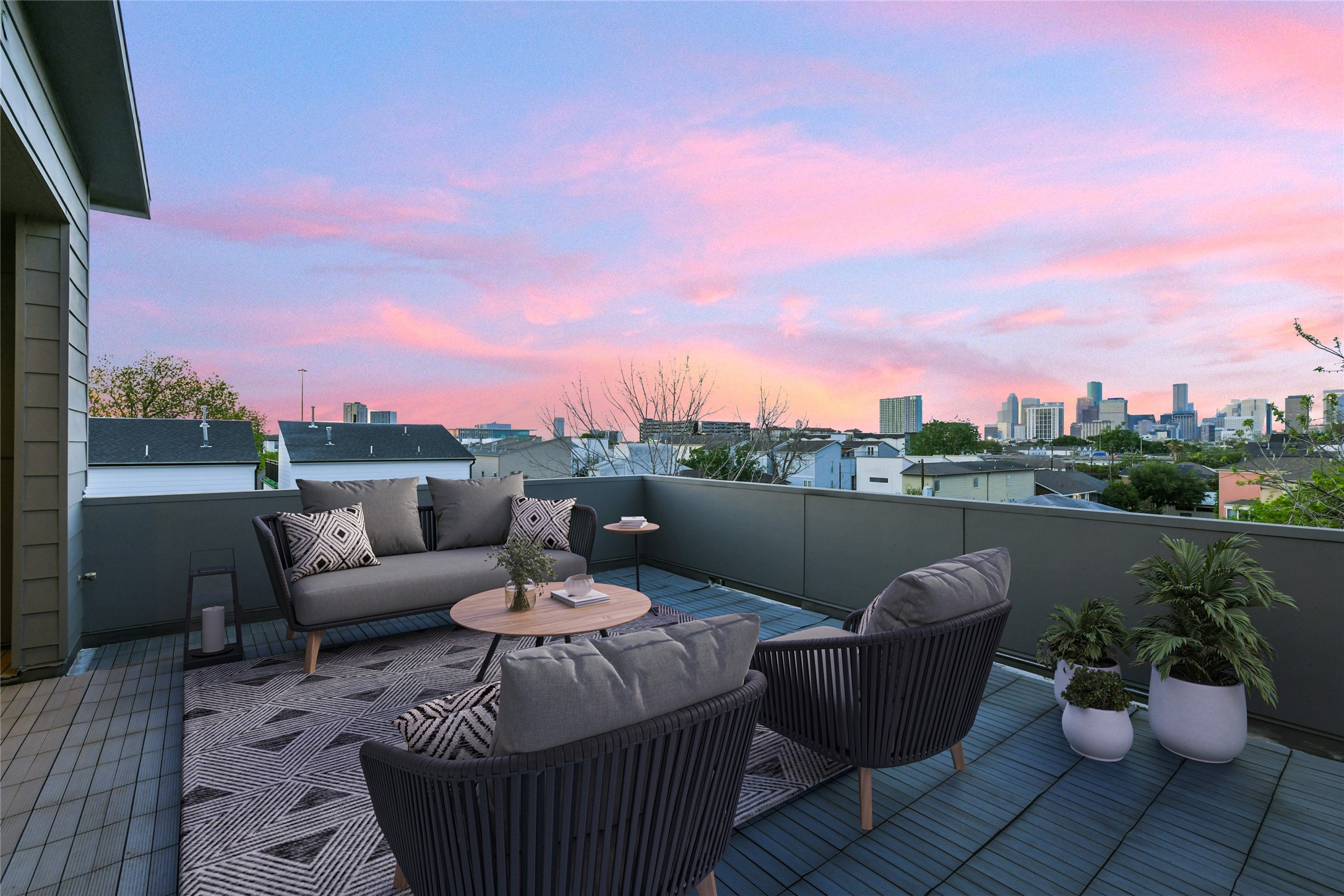 a view of a patio with couches and potted plants