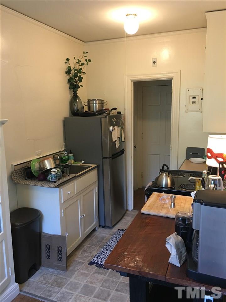 2402 Clark Avenue, Unit 10 Raleigh, NC 27607 - Photo 16 of 19 a kitchen with a table and chairs