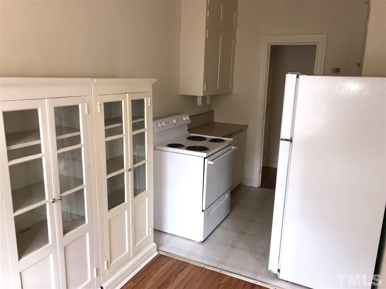 2402 Clark Avenue, Unit 10 Raleigh, NC 27607 - Photo 4 of 19 a kitchen with a stove and a refrigerator
