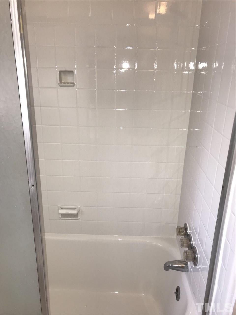 2402 Clark Avenue, Unit 10 Raleigh, NC 27607 - Photo 8 of 19 a bathroom with a bathtub