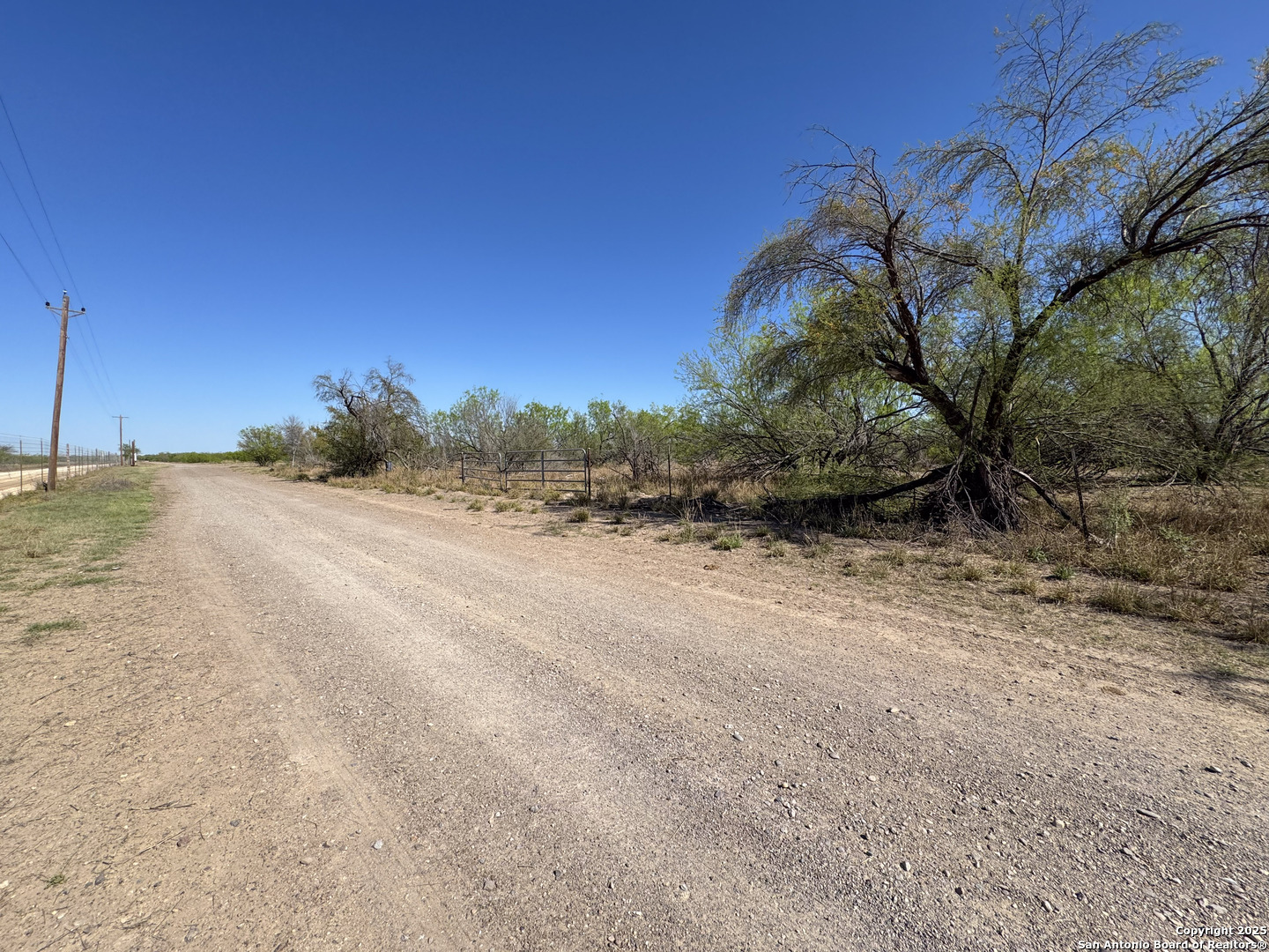 0 Mines Road Laredo, TX 78045 - Photo 13 of 40 a view of a dry yard with wooden fence