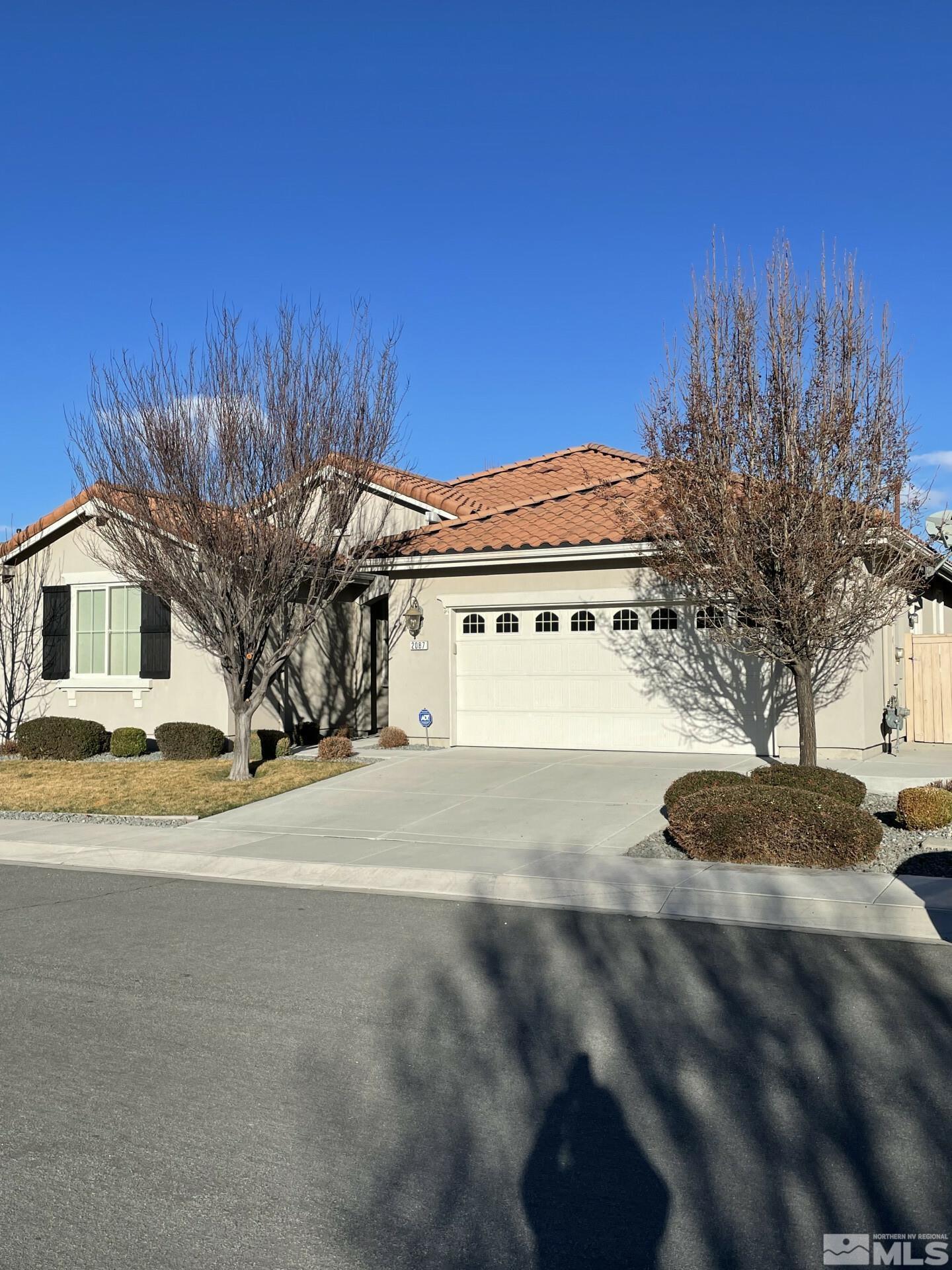 2087 Whitecliff Drive Reno, NV 89521 - Photo 1 of 33 a view of a house with a street