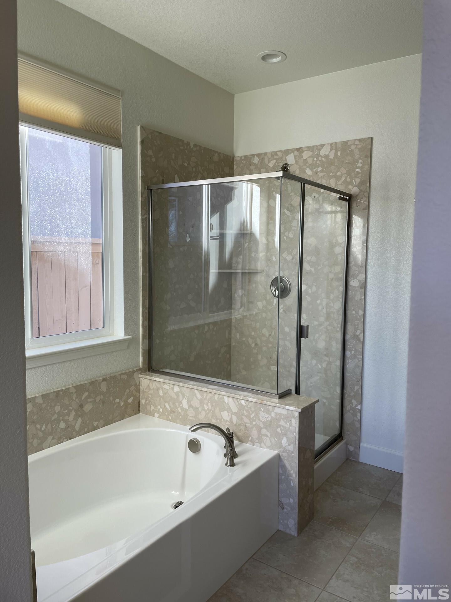 2087 Whitecliff Drive Reno, NV 89521 - Photo 17 of 33 a bathroom with a tub shower and sink