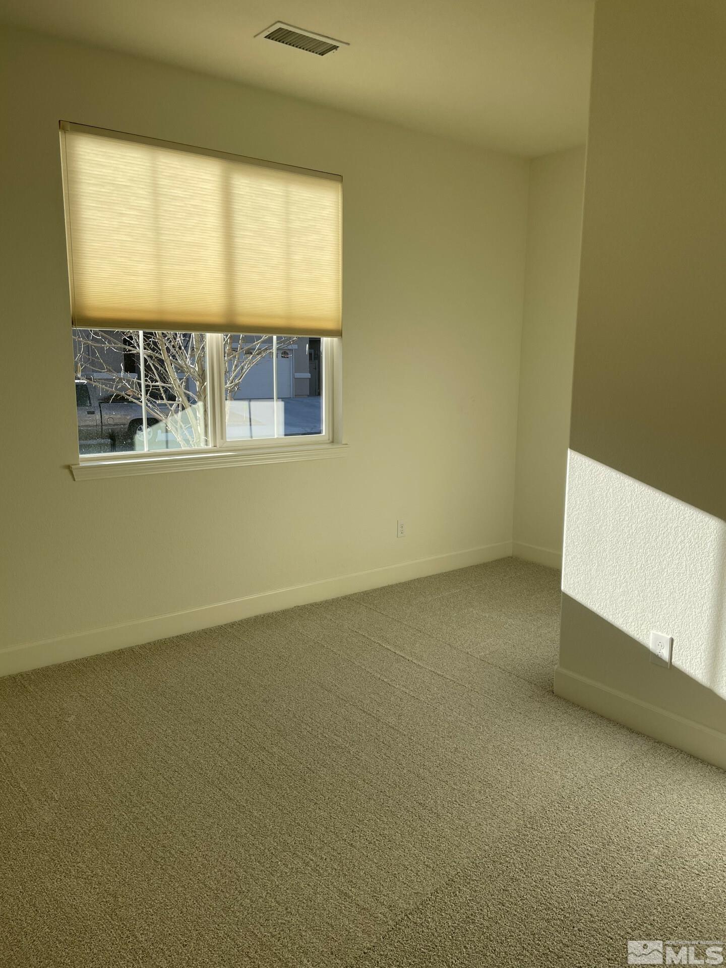 2087 Whitecliff Drive Reno, NV 89521 - Photo 21 of 33 a view of an empty room with a window